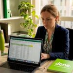 SME owner working on AI-enabled laptop
