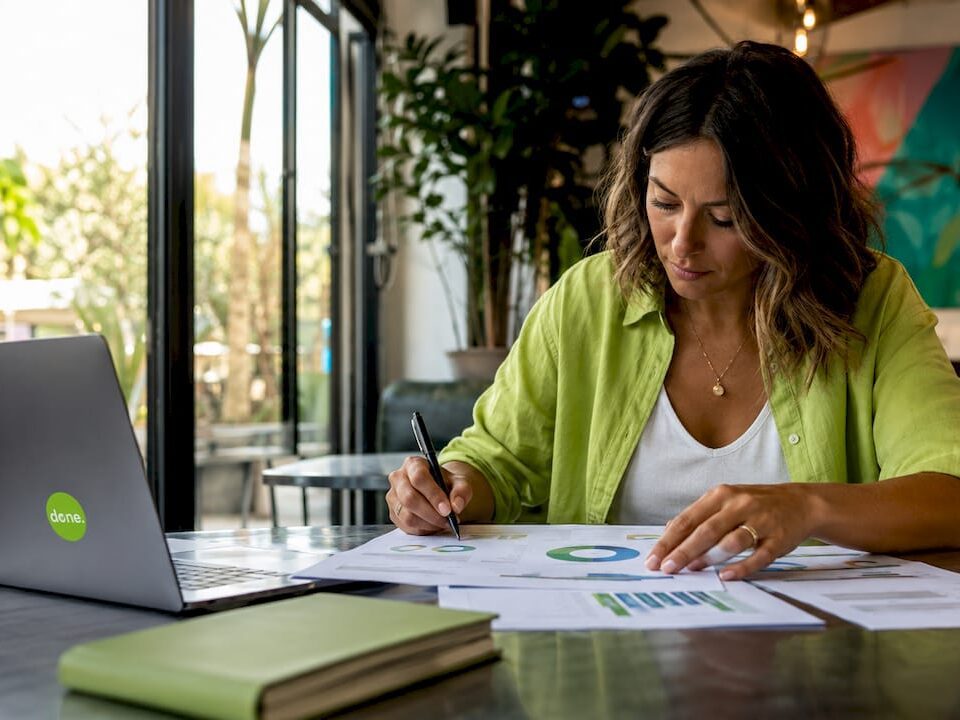 Person analyzing printed website performance reports
