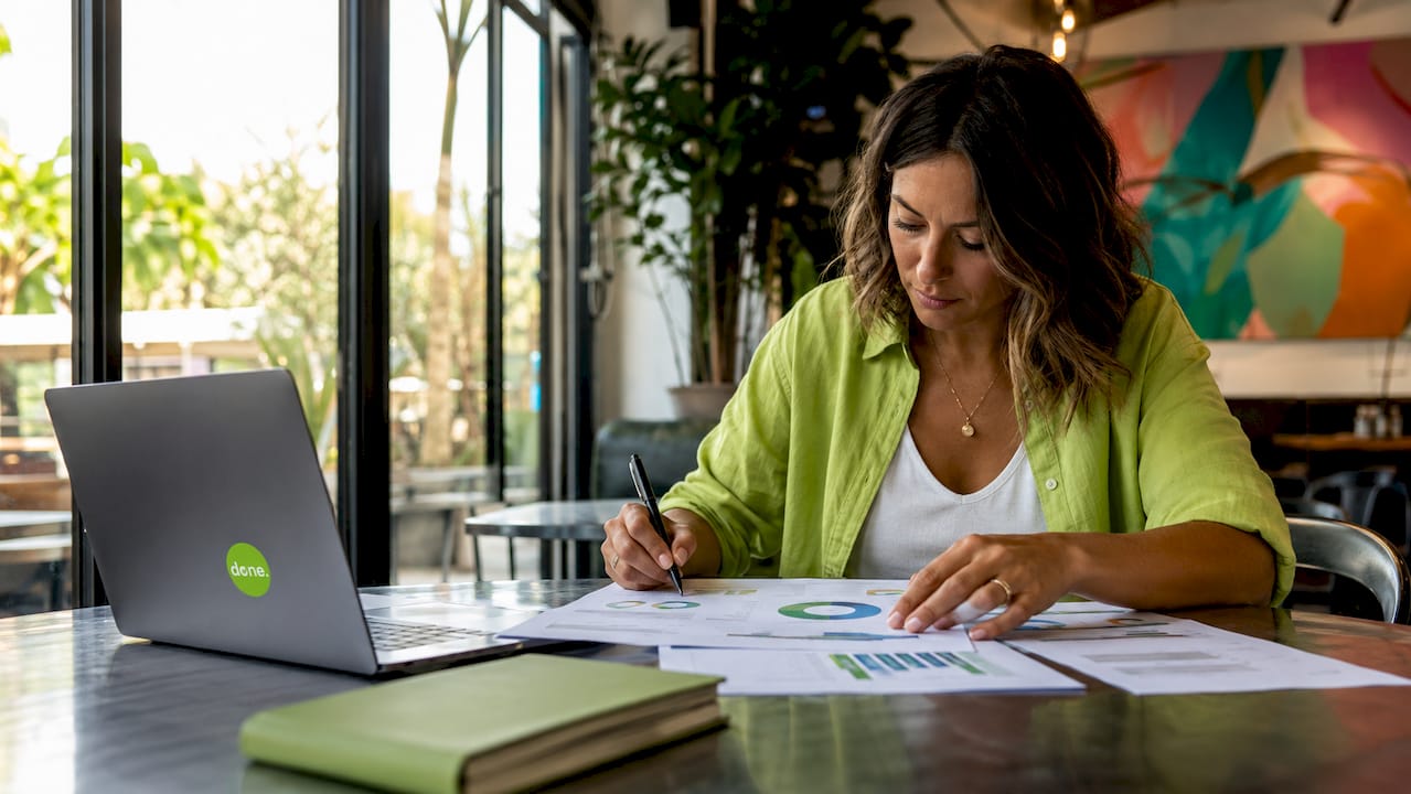 Person analyzing printed website performance reports