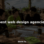 Web design team collaborating over wireframes in office