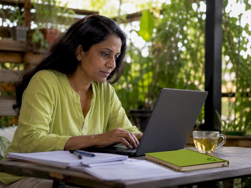 Woman working on local SEO laptop
