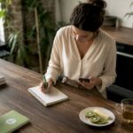 Woman planning content strategy at home table
