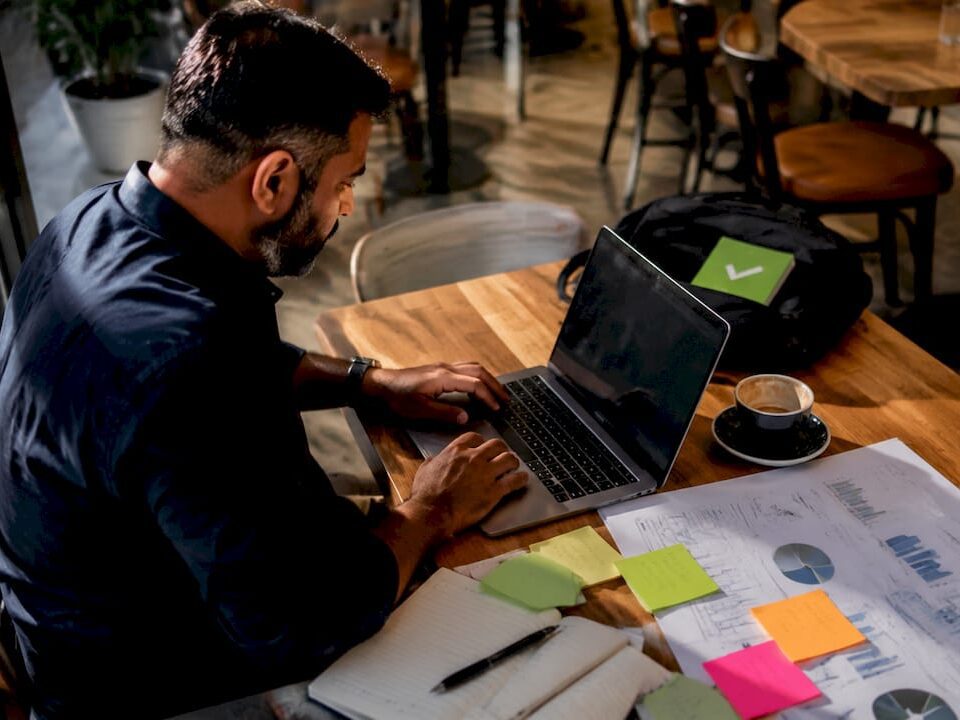 Digital marketer working on SEM campaign at home desk