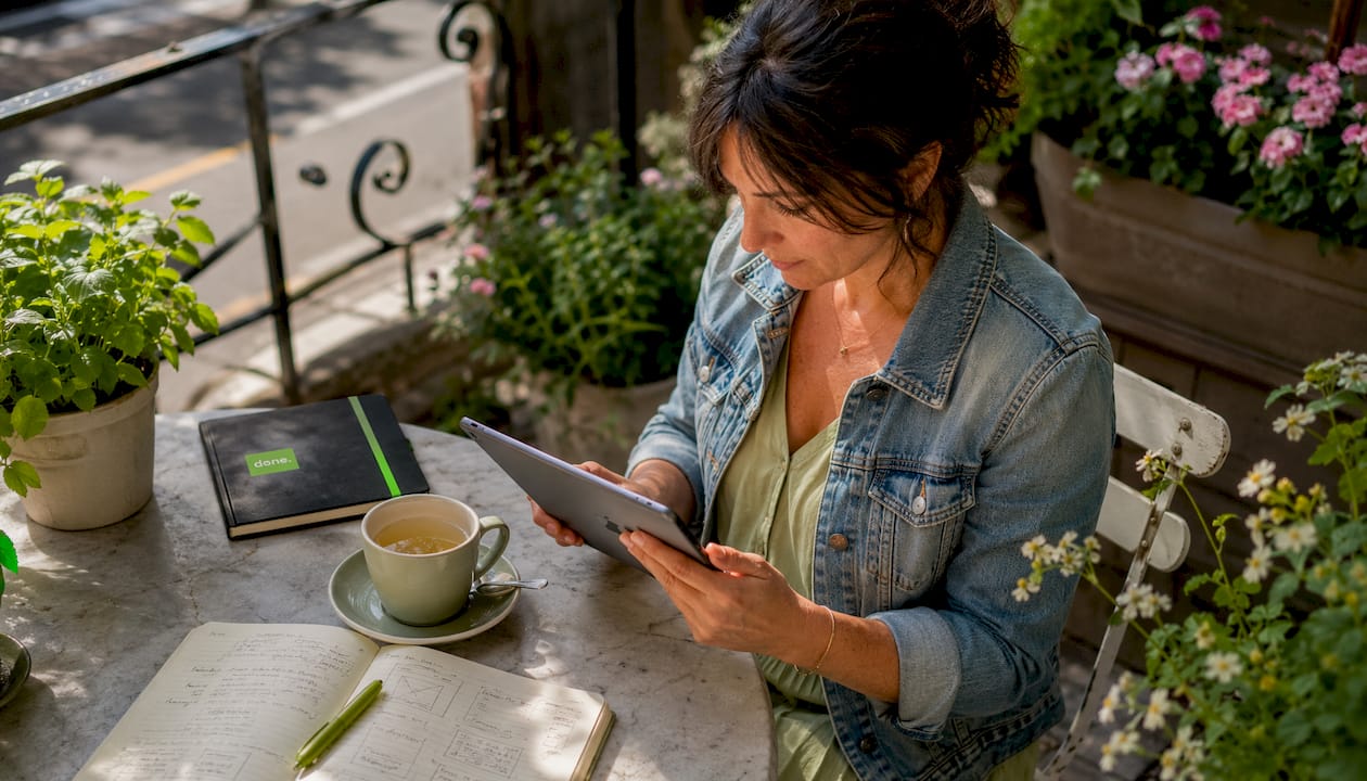 Woman reviewing digital documents in café