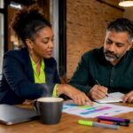 Consultant and SME owner discussing branding strategy