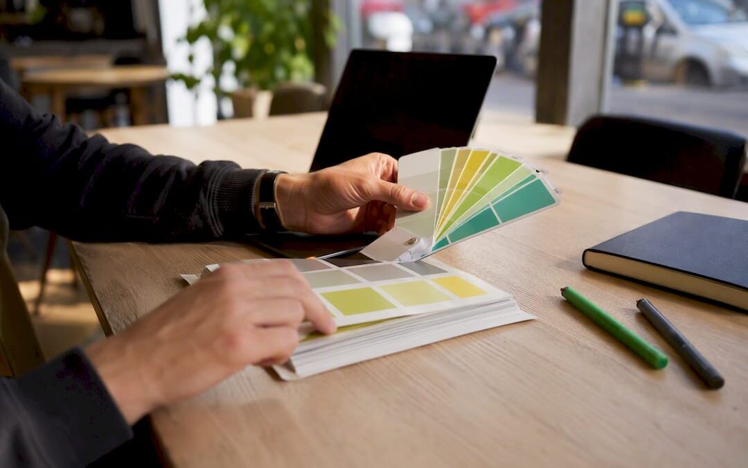 Hands adjusting color palette for branding