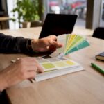 Hands adjusting color palette for branding