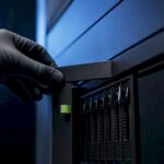 Technician accessing secure AI storage enclosure