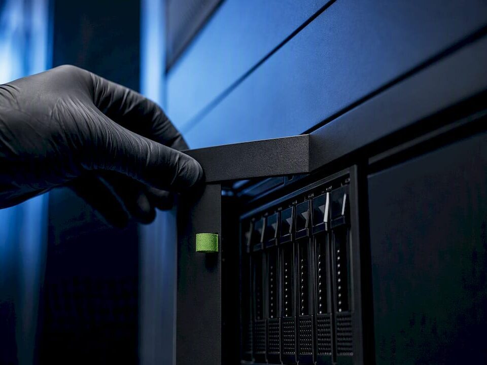 Technician accessing secure AI storage enclosure