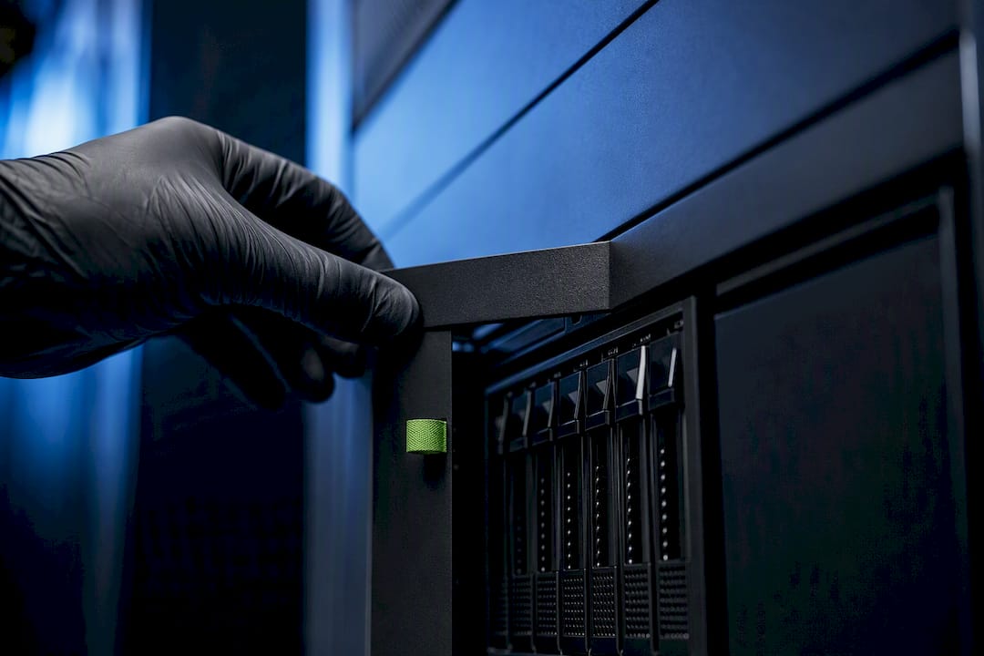 Technician accessing secure AI storage enclosure